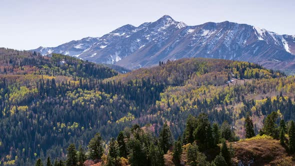 Zoomed aerial view flying towards mountains in Fall