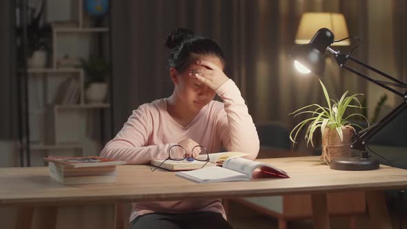 Asian Child Doing Homework And Headache At Night