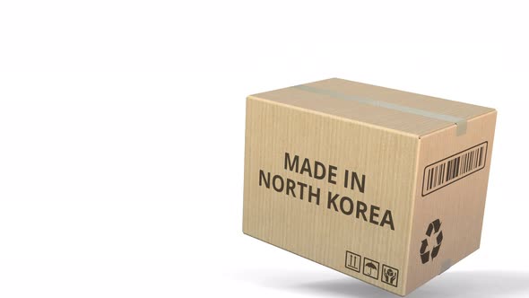 Falling Carton with MADE IN NORTH KOREA Text