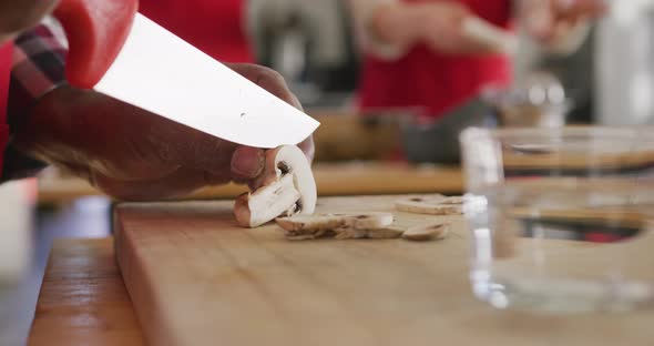 Chef cutting mushrooms