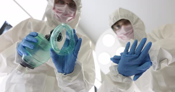 Doctors in Protective Suits Providing Resuscitation Assistance to Patient  Movie