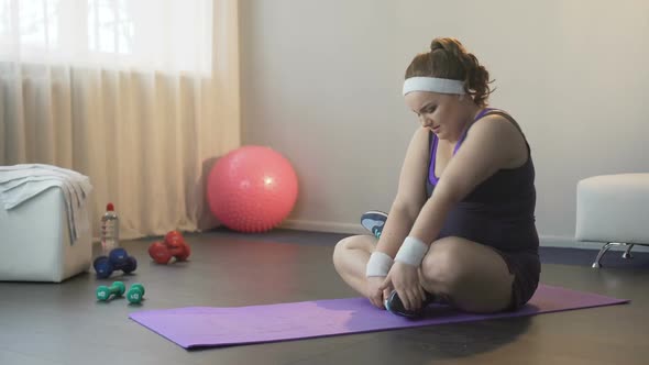 Obese Girl Hardly Trying to Take Lotus Position for Finding Peace of Mind, Yoga