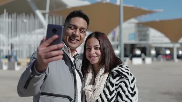 Smiling Young Couple Posing for Selfie