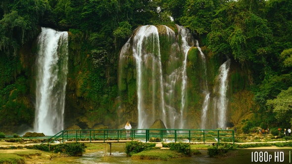Back of Woman Standing in Front of Bao Gioc Waterfall in Cao Bang, Vietnam