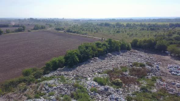 Shooting From the Height of the Dump Truck's Arrival at the Landfill Site. Aerial Photography.