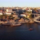Drone Footage of People Walking Along the Porto Embankments at Sunset - VideoHive Item for Sale