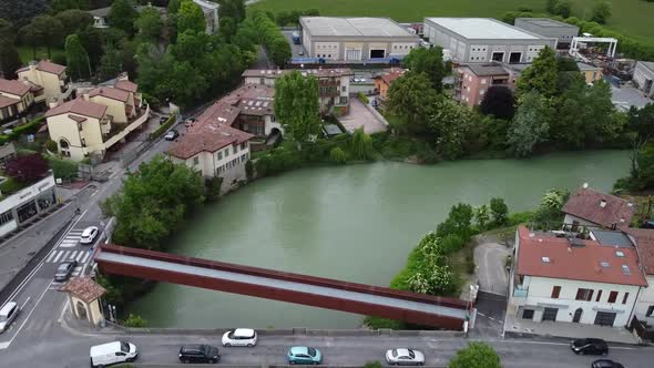 Flying over a river passing over a bridge, aerial images with drone