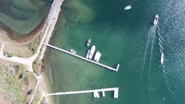 Aerial View Of Boats Sailing In The Ocean With Jetty Near Edgartown Harbor And Lighthouse Beach.