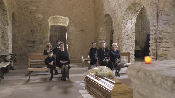 Mourners at funeral service in church