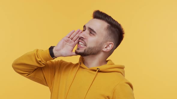 Expressive young man screaming and shouting over vibrant background.