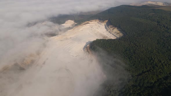Aerial View of Open Pit Mining of Limestone Materials for Construction Industry with Excavators and