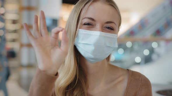 Portrait of Young Girl in Protective Medical Mask Caucasian Woman Showing Sign Okay Joyful Blonde
