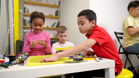 Kids Using Building Kit to Create Toys