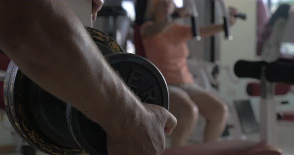 Fixing Weight Plate on the Bar-bell