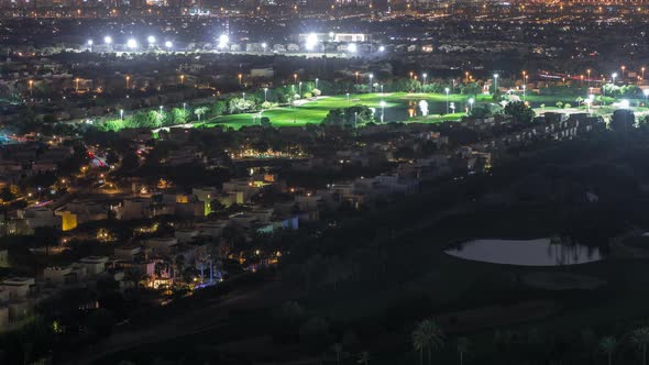 Aerial View to Villas and Houses with Golf Course Night Timelapse