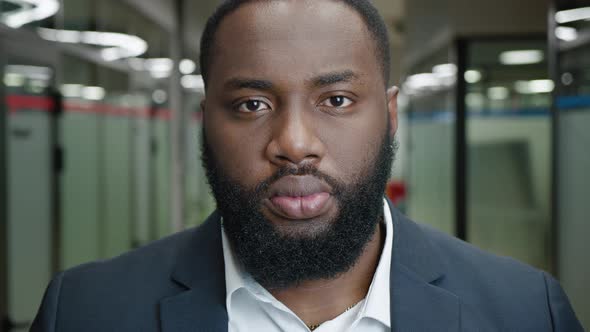 Closeup Portrait of Serious African American Bearded Businessman in the Corridor of an Office