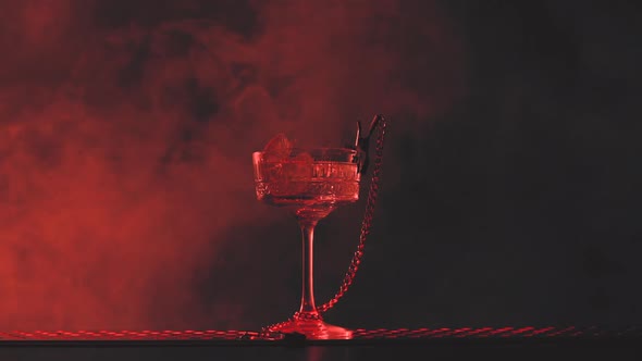 Sensual Cocktail in Smoke and Red Light