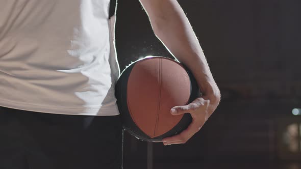 Unrecognizable Basketball Player with Ball