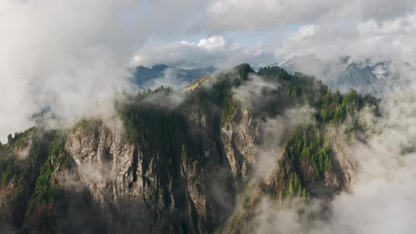 Aerial Clouds Over Lush Rainforest Mountain During Rainy Season in Northwest USA