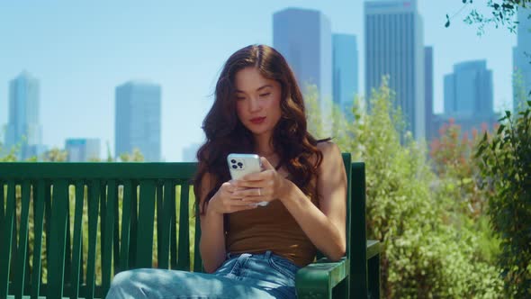 Woman Tourist Dial Phone Number Sitting on Bench