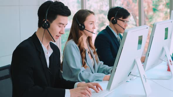 Business People Wearing Headset Working in Office