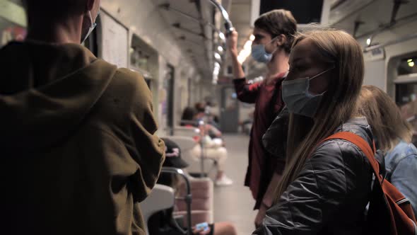 People in Face Masks in Metro Car During Lockdown