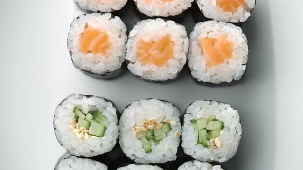 Fresh Sushi Roll Set Rotating. Typical Japanese Food, Dish Consisting of Rice, Avocado, Salmon, Tuna