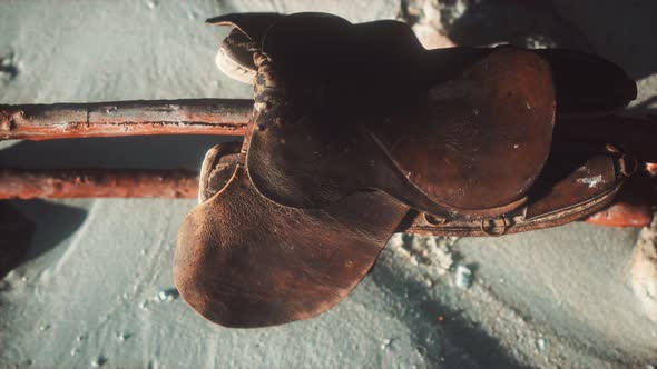 Rider Leather Saddle on Fence in Desert