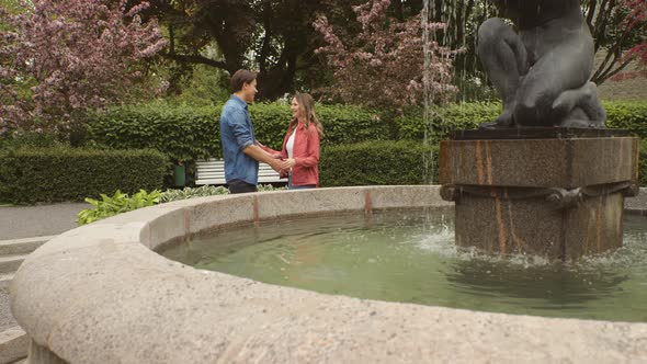 Young, happy, loving couple having date in the park. Relations, friendship and love concept.