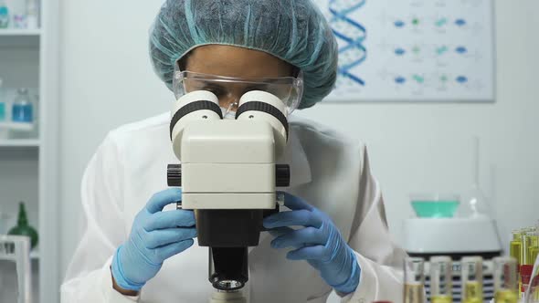 Medical Analyst Zooming on Microscope While Doing DNA Analysis, Medical Test