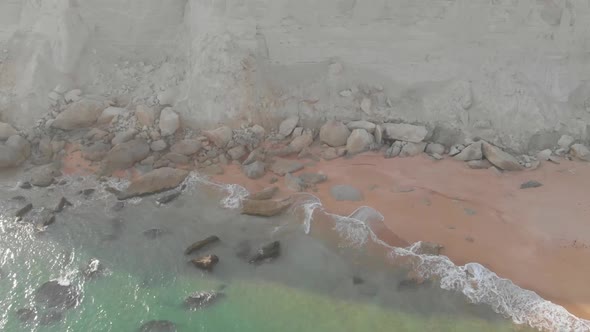 Aerial rotating shot of Jiwani beach of Baluchistan which is surrounded by hills.