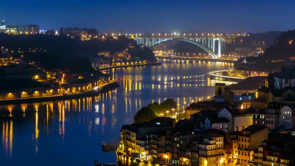 City of Porto and Gaia at Night By the Douro River Timelapse in Portugal Arrabida Bridge at the Far