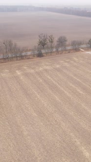 Vertical Video Empty Plowed Field in Autumn Aerial View