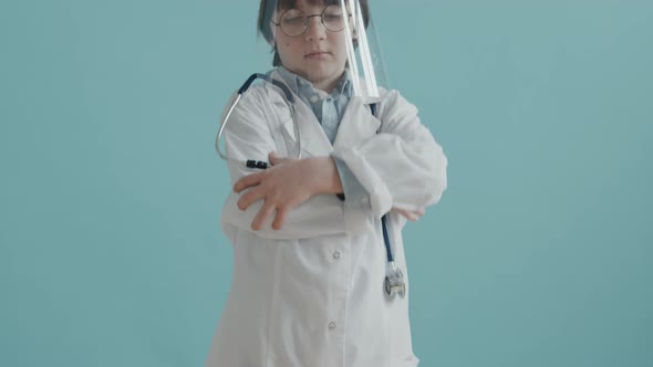 Portrait of Little Boy in Doctor Costume Posing