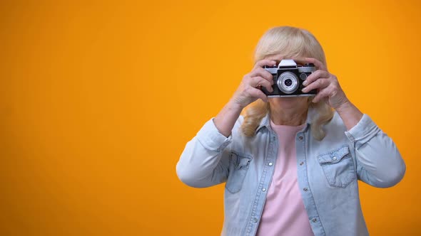 Happy Smiling Retiree Woman Taking Photo, Hobby and Relaxation, Leisure Time