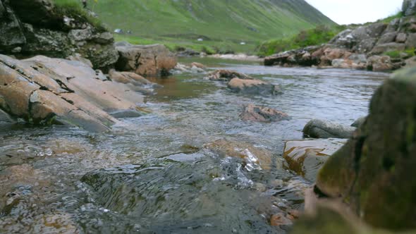 Natural water flows through rocks in highlands