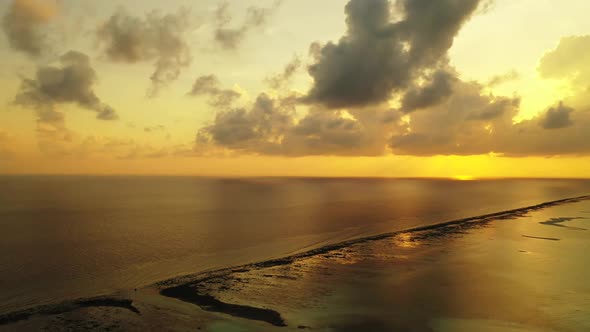 Aerial above travel of idyllic bay beach adventure by blue lagoon and white sandy background of jour