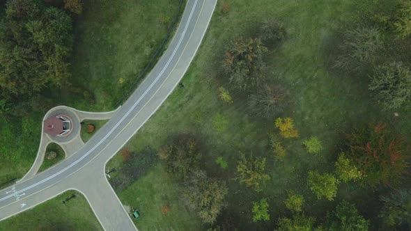 Flight over the autumn park in cloudy weather.