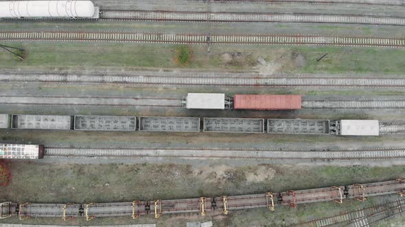 Aerial view of colorful freight trains on the railway station