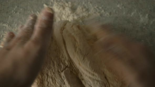 Female Hands Gently Knead the Dough with Pumpkin