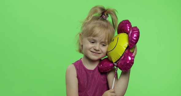 Girl Holds Balloon in the Form of Flower. Happy Four Years Old Girl. Chroma Key