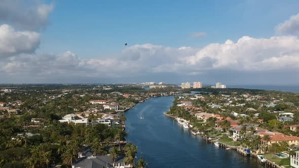 Aerial shot defending along the intercostal in Florida with a Blimp near by