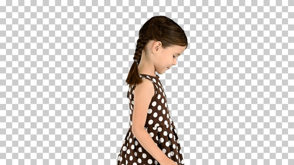 Smiling little girl in polka dot dress walking, Alpha Channel