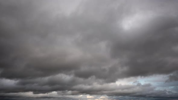 Timelapse of a dark cloudy sky alt