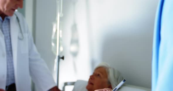 Nurse writing on the clipboard in the hospital