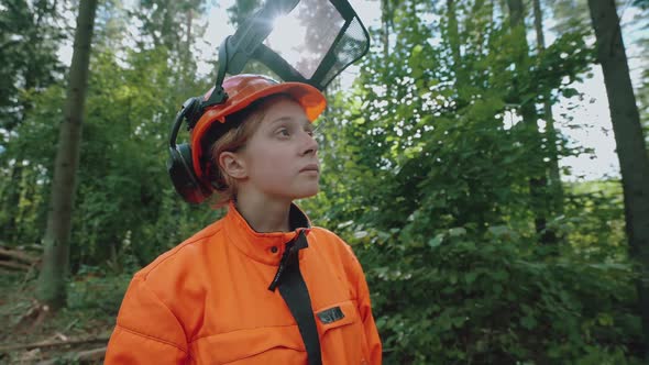 Hard Work Portrait of a Female Logger Standing in the Forest a Young Specialist Woman in Protective