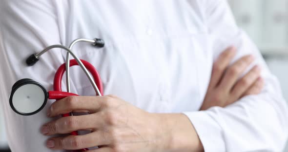 Hands of General Practitioner Holding Stethoscope Closeup