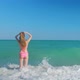 Tall Woman with a Long Hair From a Back is on a Beach - VideoHive Item for Sale