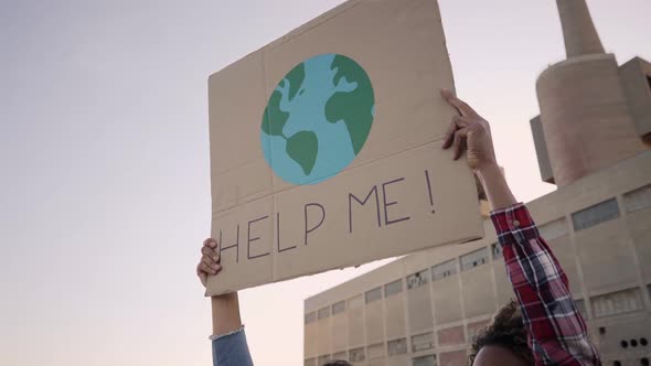 Help Me Poster Claim During a Street Protestor for Climate Change