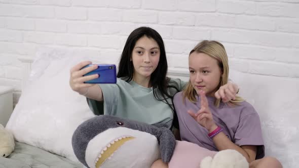 Two Young Multinational Girls Spending Time Together Pajama Party